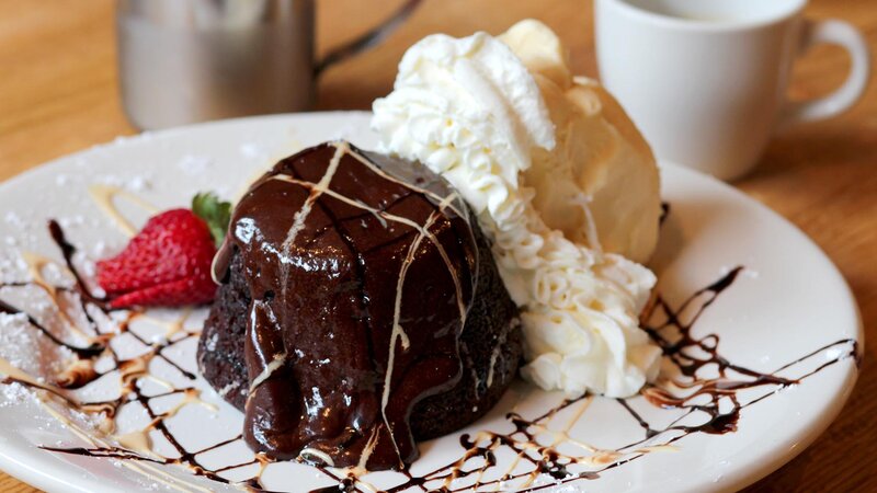 Chocolate lava cake with side of vanilla ice cream dessert